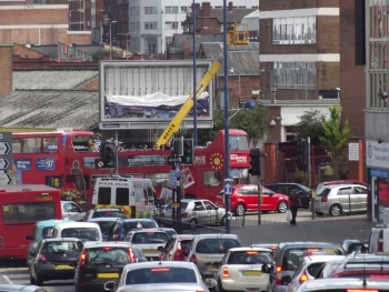 Big Brum Buz stuck in traffic in Digbeth - mobile crane